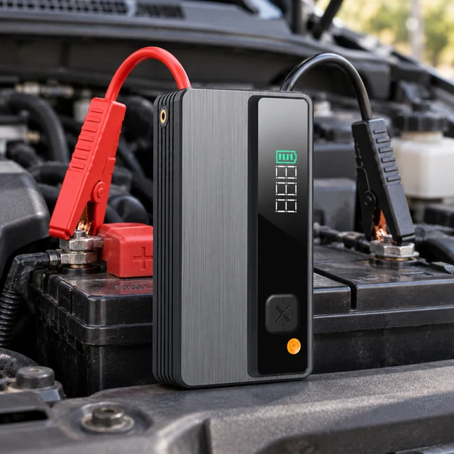 Car Jump Starters in a representative portable jump starter beside a stationary car battery with correctly oriented insulated clamps and no sparks setting