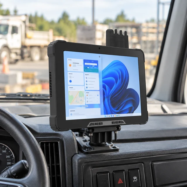 Vehicle Tablets in a representative rugged tablet correctly secured to a realistic dashboard bracket in a stationary work vehicle setting
